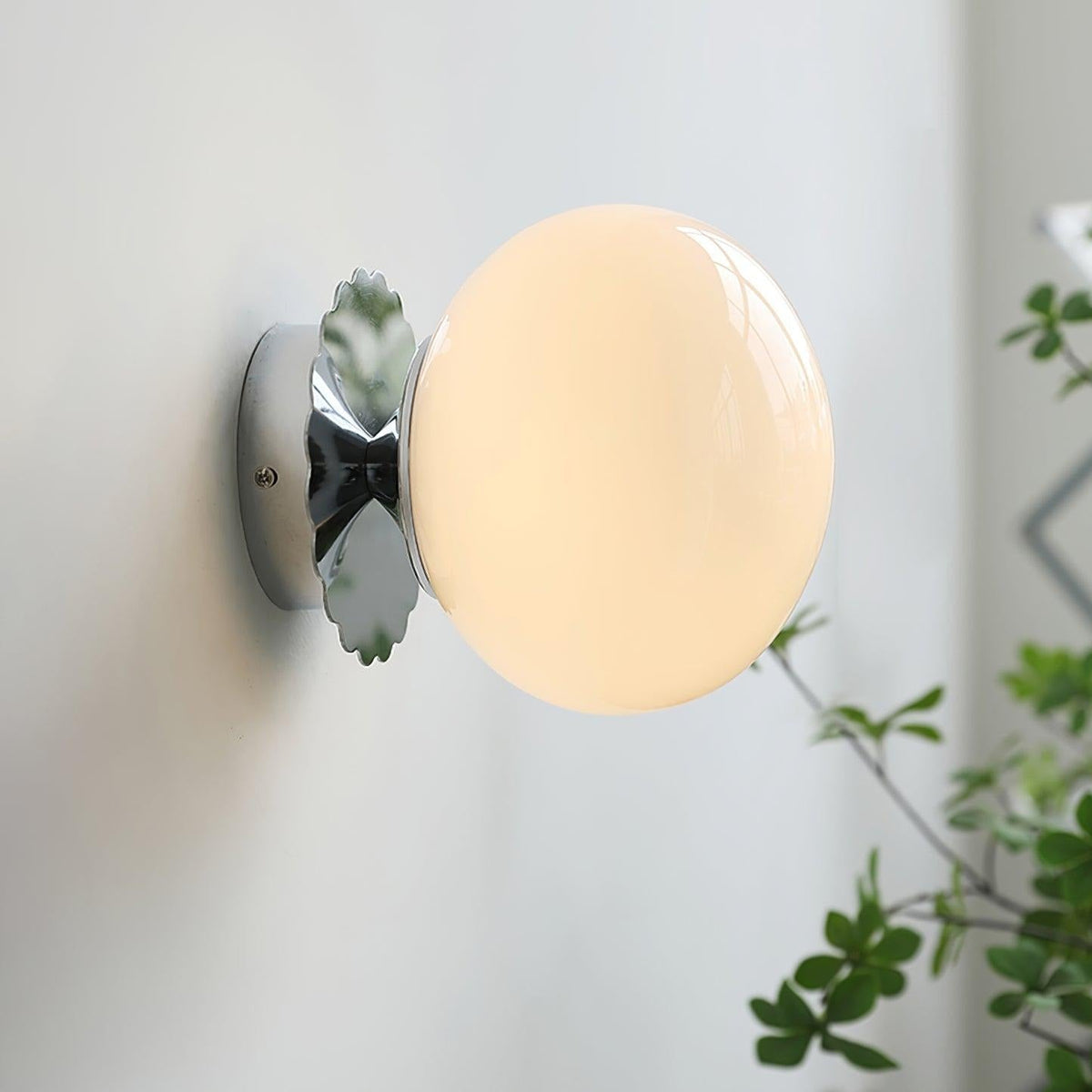 Marshmallow sconce providing ambient light in dining room