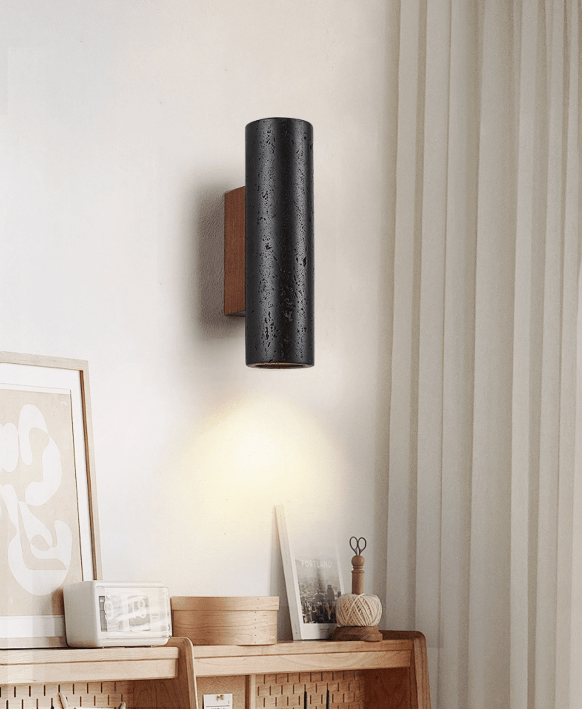 Sconce mounted on white wall showing lighting profile