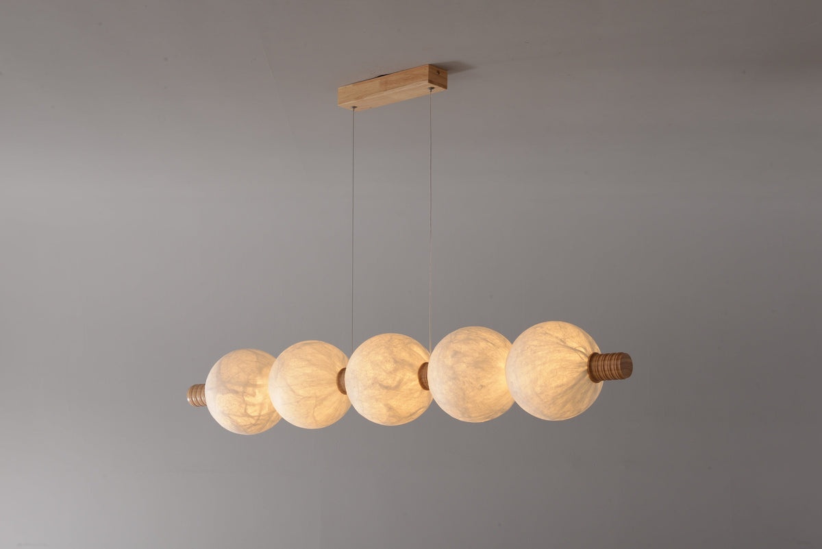 5-globe horizontal natural mulberry silk pendant with light wood details, real product photograph
