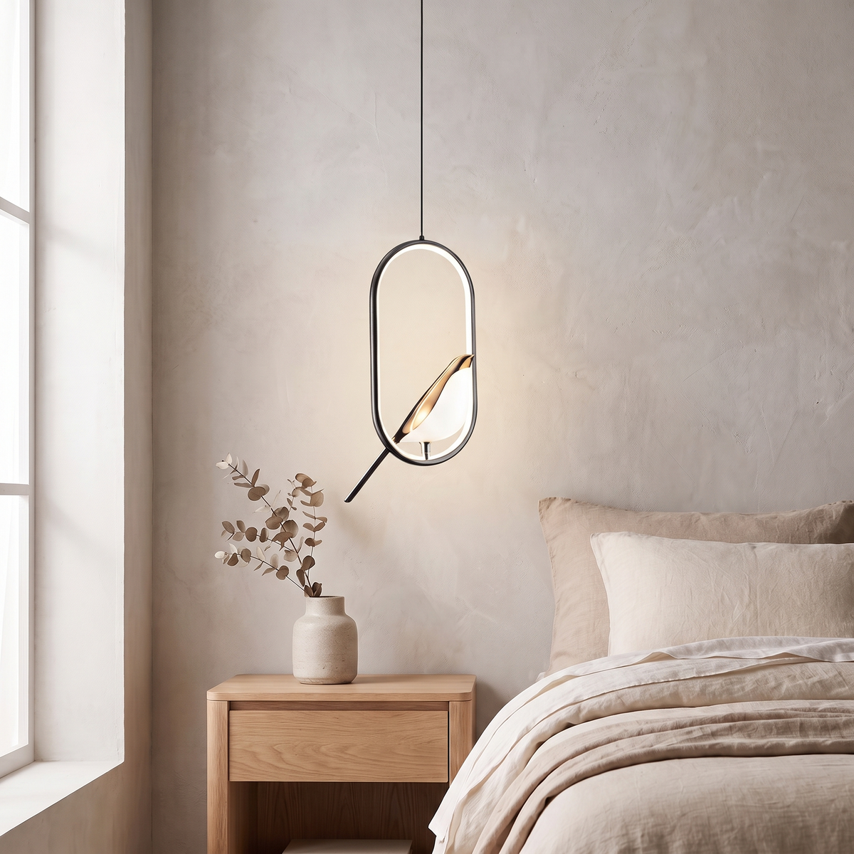 Tind bird pendant light, black oval frame, above an oak nightstand