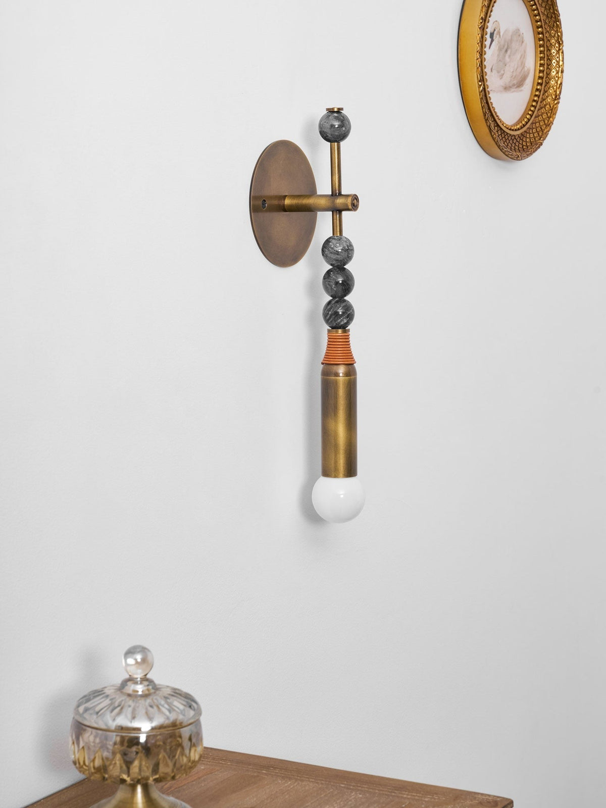 Torto wall-mounted sconce in entry hallway