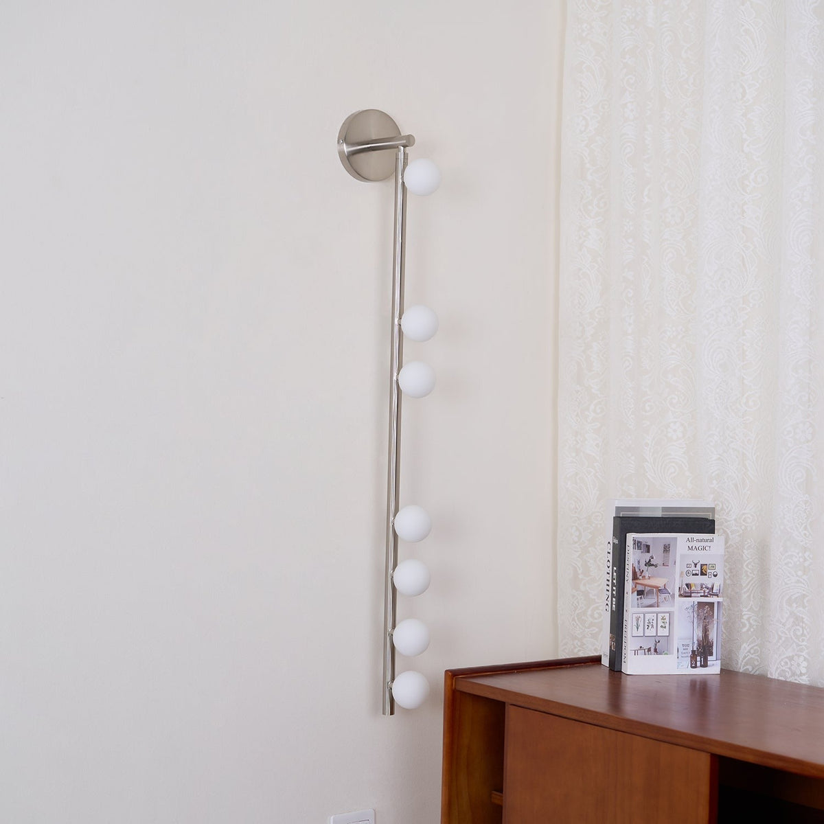 Vouga seven-B sconce mounted on white wall